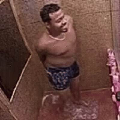 Man Showering in Bathroom