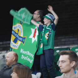 Man Showing Flag Of Northern Ireland Football Team GIF