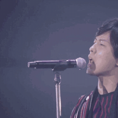 Man Singing Into Microphone GIF