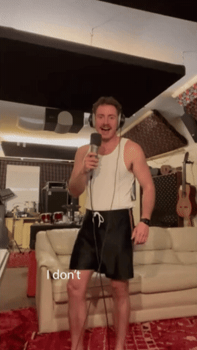 Man Singing Into Microphone GIF
