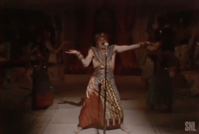 Man Singing Into Microphone At SNL Sign GIF