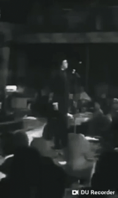 Man Singing Into Microphone Black And White GIF