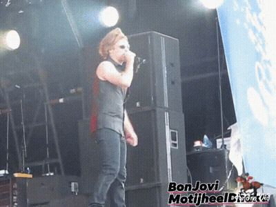 Man Singing Into Microphone Bon Jovi