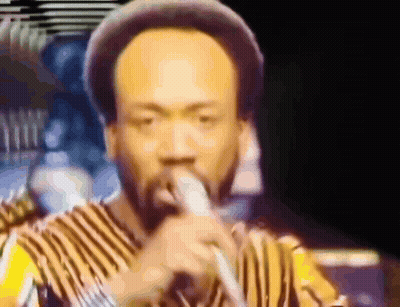 Man Singing Into Microphone GIF