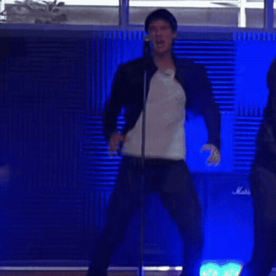 Man Singing Into Microphone Dancing Beside Marshall Amp GIF