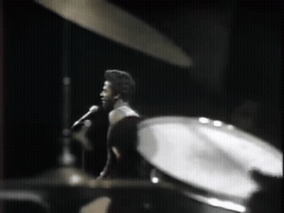 Man Singing Into Microphone Drums GIF