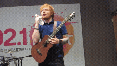 Man Singing Into Microphone Holding Guitar 021 GIF
