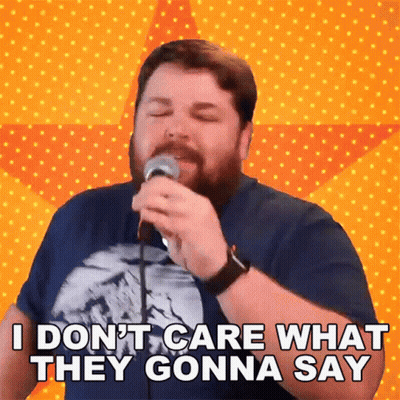 Man Singing Into Microphone I Don't Care What They Gonna Say GIF