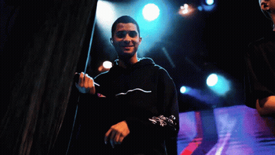 Man Singing Into Microphone In Black Hoodie GIF