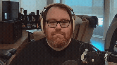 Man Singing Into Microphone In Blue Jacket GIF
