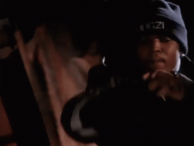 Man Singing Into Microphone In Dark Room GIF