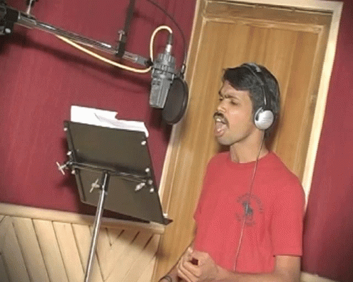 Man Singing Into Microphone In Headphones GIF