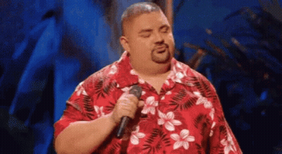 Man Singing Into Microphone In Red Floral Shirt GIF