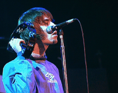 Man Singing Into Microphone In Umbro Jacket GIF