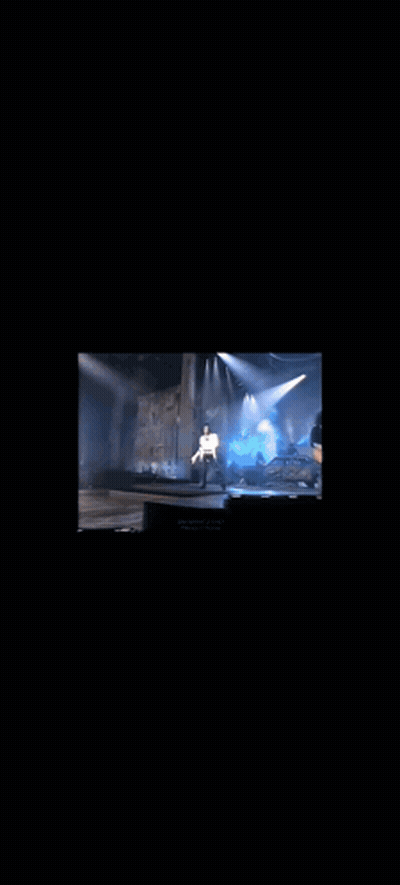 Man Singing Into Microphone In White Shirt GIF