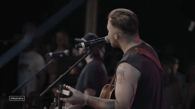 Man Singing Into Microphone GIF