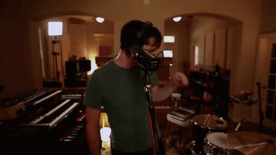 Man Singing Into Microphone GIF