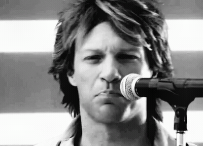 Man Singing Into Microphone Making Face GIF
