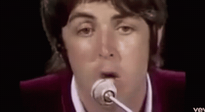 Man Singing Into Microphone Making Funny Face GIF