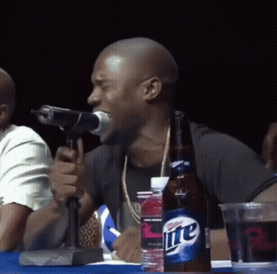 Man Singing Into Microphone Next To Miller Lite GIF