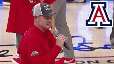 Man Singing Into Microphone On Basketball Court With Letter A GIF