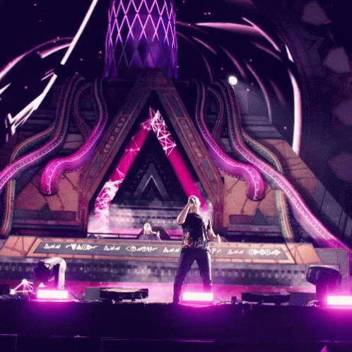 Man Singing Into Microphone On Stage GIF