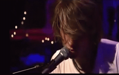 Man Singing Into Microphone GIF