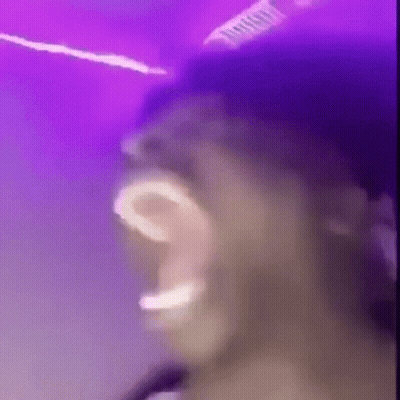 Man Singing Into Microphone Playing Drums GIF