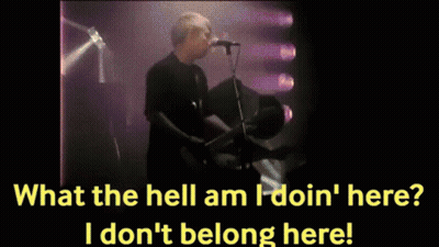 Man Singing Into Microphone Playing Guitar GIF