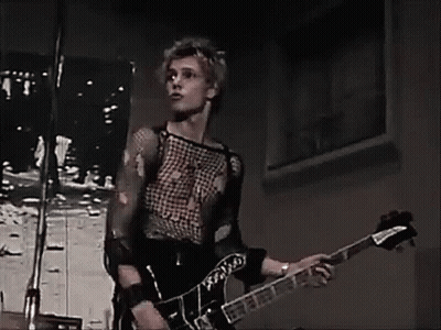 Man Singing Into Microphone Playing Guitar GIF
