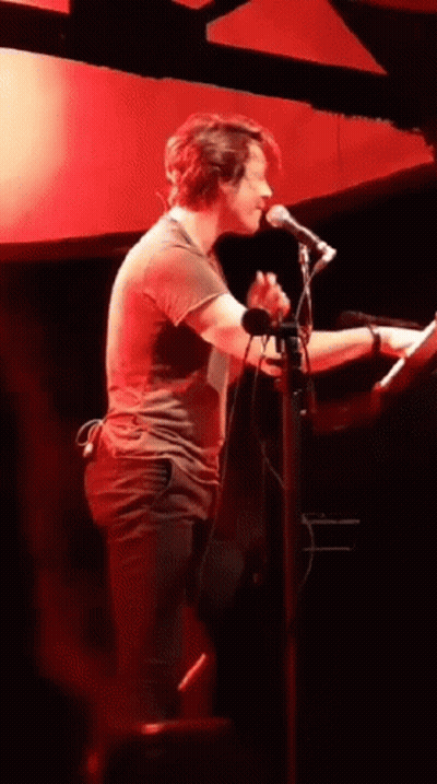 Man Singing Into Microphone Playing Keyboard GIF