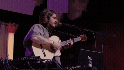 Man Singing Into Microphone Playing Yamaha Guitar GIF