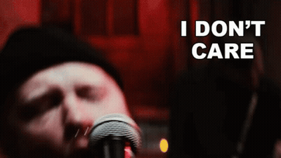 Man Singing Into Microphone Saying I Don't Care GIF
