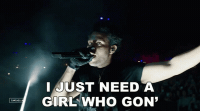 Man Singing Into Microphone Saying I Just Need A Girl Who Gon GIF