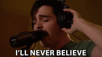 Man Singing Into Microphone Saying I'll Never Believe GIF