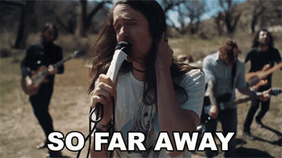 Man Singing Into Microphone So Far Away GIF
