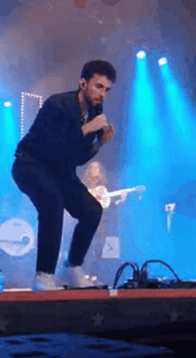 Man Singing Into Microphone GIF