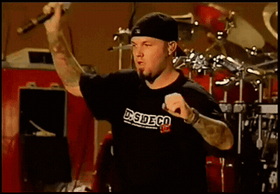 Man Singing Into Microphone Wearing DS Side Co Shirt GIF