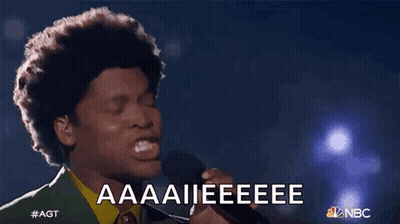 Man Singing Into Microphone With Aaaii Eeeee GIF