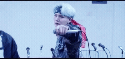 Man Singing Into Microphone With Bandana GIF