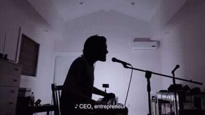 Man Singing Into Microphone With CEO Entrepreneur