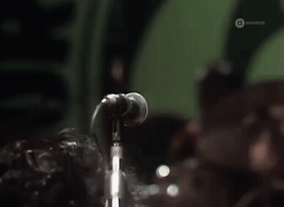 Man Singing Into Microphone With Eyes Closed GIF