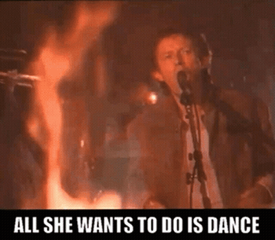 Man Singing Into Microphone With Fire GIF