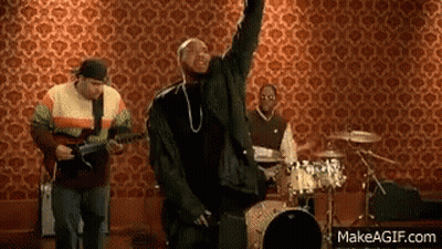 Man Singing Into Microphone With Guitar And Drums GIF