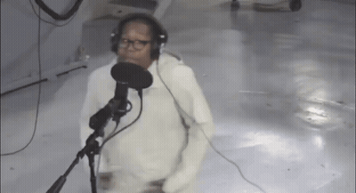 Man Singing Into Microphone With Headphones GIF