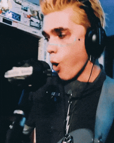 Man Singing Into Microphone With Headphones GIF