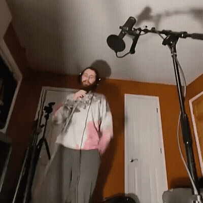 Man Singing Into Microphone With Headphones GIF