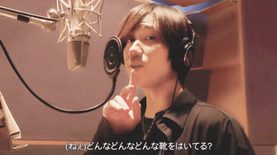 Man Singing Into Microphone With Headphones GIF