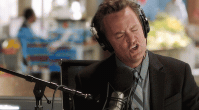 Man Singing Into Microphone With Headphones GIF