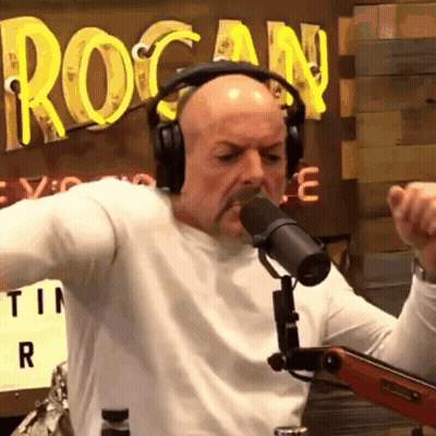 Man Singing Into Microphone With Headphones GIF